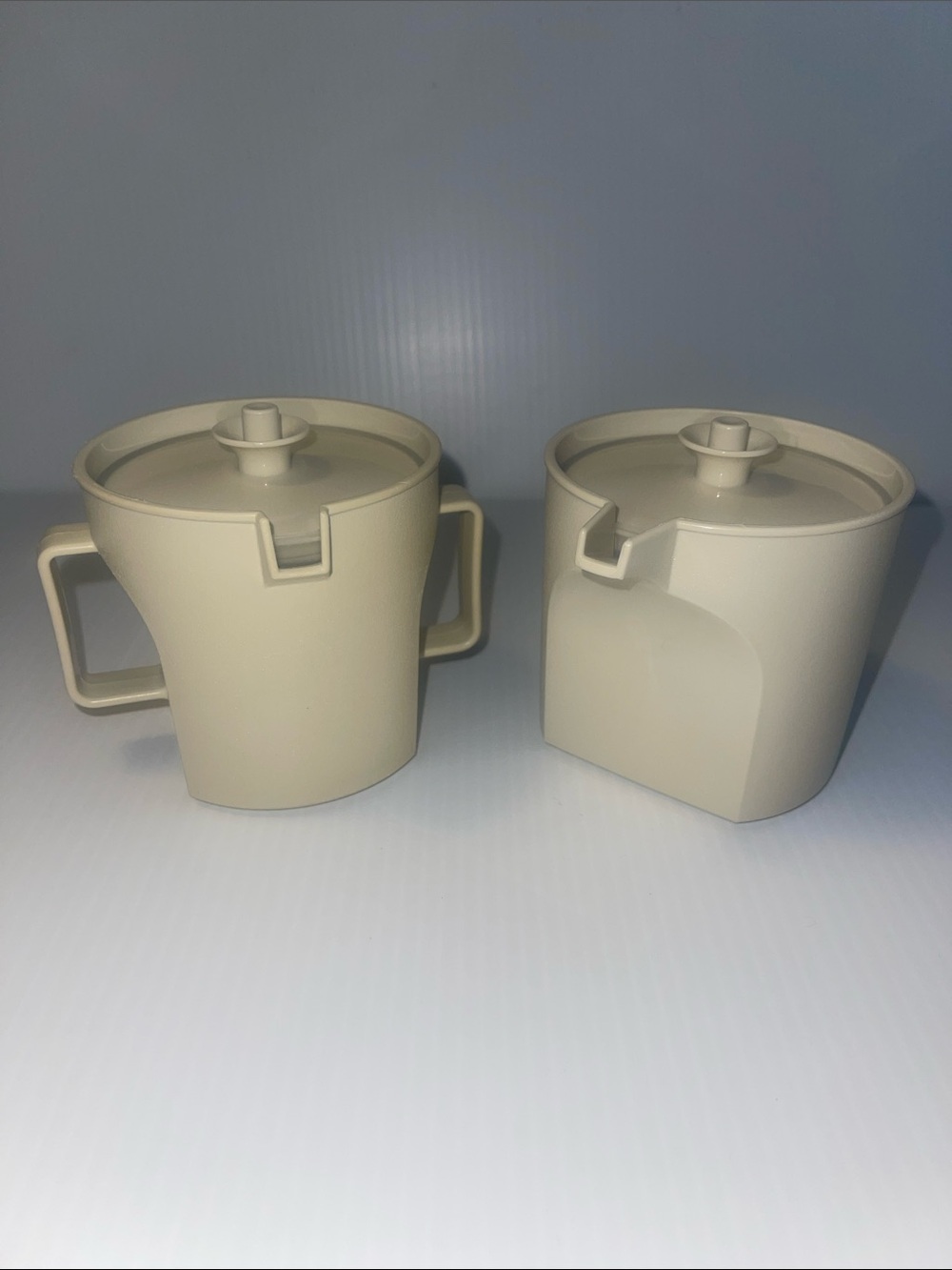Tupperware cream and sugar containers